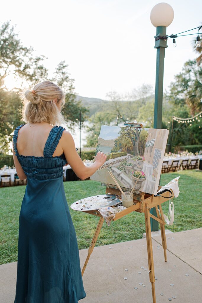 live painter at outdoor wedding reception in Austin, TX